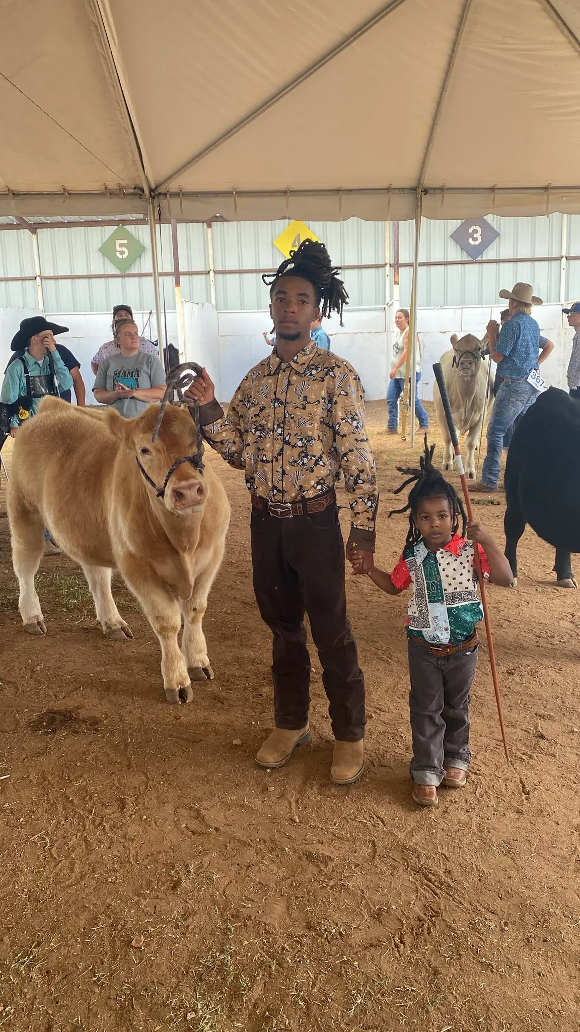 Jason and Amour with a calf